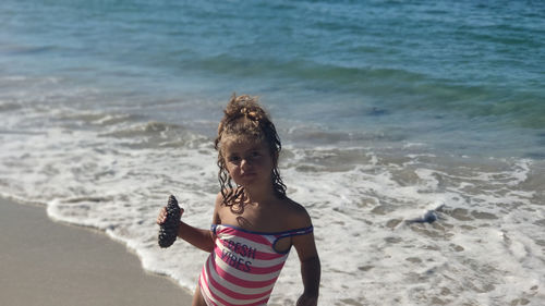 Girl playing in the beach 