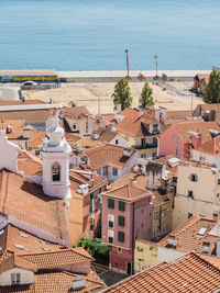 High angle view of townscape by sea