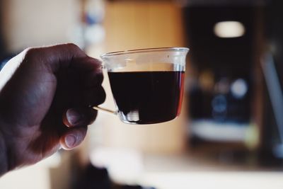 Close-up of hand holding wineglass