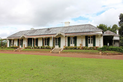 House on field against sky