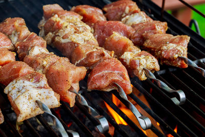 Close-up of meat on barbecue grill