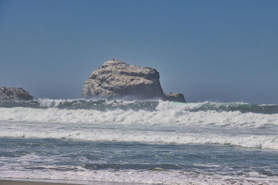 Scenic view of sea against clear sky