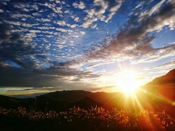 Sun shining through clouds