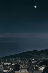 Aerial view of town against sky at night