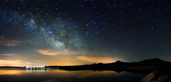 Scenic view of lake against star field