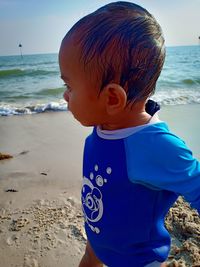 Boy wearing sunglasses on beach