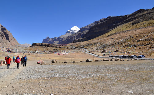 Tourists on rocky mountain