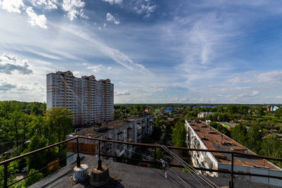 High angle view of russian suburbs residential buildings against sky at summer day