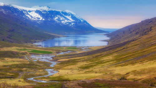 Scenic view of snowcapped mountains against sky