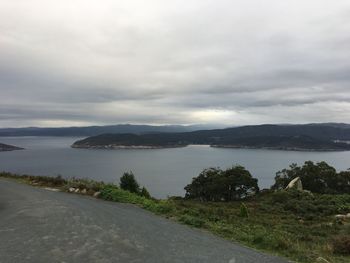 View of calm sea against cloudy sky