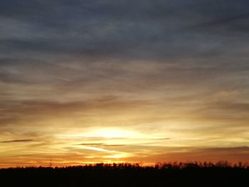 Scenic view of dramatic sky during sunset