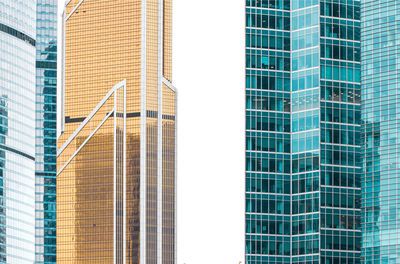 Low angle view of modern building in city against sky