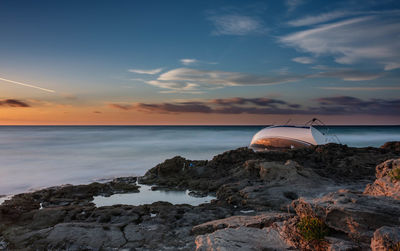 Scenic view of sea against sky during sunset