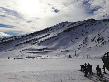 People on snow covered landscape