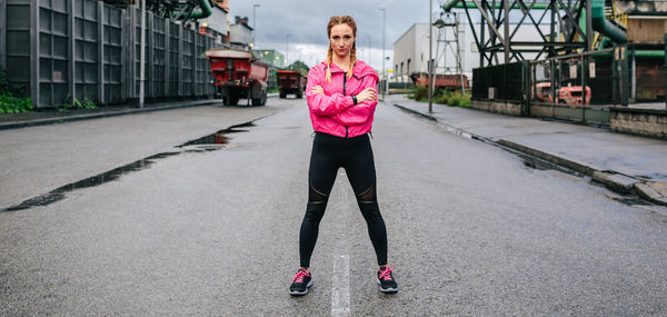 Full length of woman standing on road