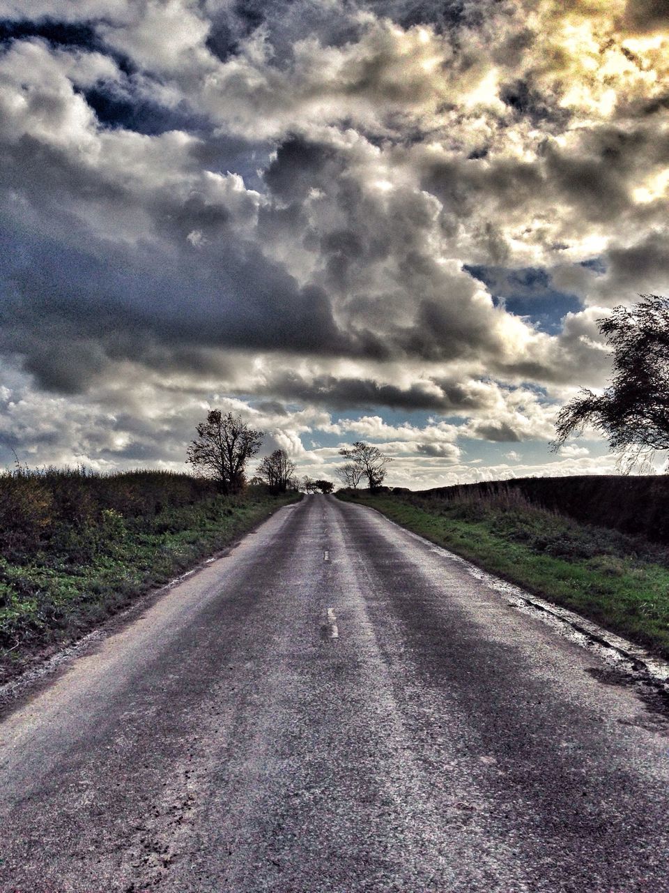 the way forward, sky, diminishing perspective, cloud - sky, vanishing point, cloudy, road, transportation, cloud, landscape, country road, tranquility, tranquil scene, field, empty road, grass, nature, tree, dirt road, long