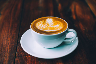 Close-up of cappuccino on table