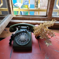 High angle view of telephone on table at home