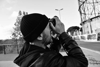 Portrait of man wearing hat against sky