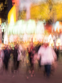 Blurred motion of people at night