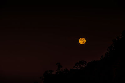 Scenic view of moon against clear sky at night