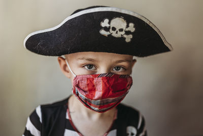 Close-up portrait of boy wearing hat