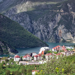 Scenic view of sea and houses in town