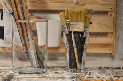 Close up of art equipment in jars on table