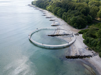 High angle view of sea amidst trees