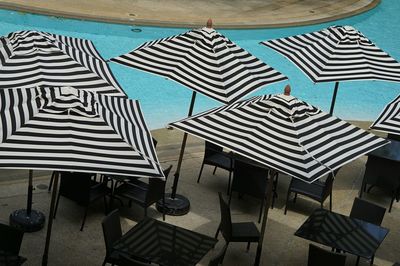 High angle view of chairs and tables at beach