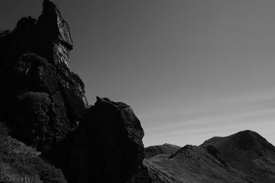 Low angle view of rock formation against sky