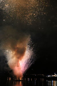 Fireworks exploding at night