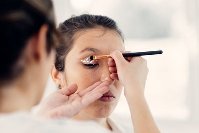 Close-up portrait of a man holding woman
