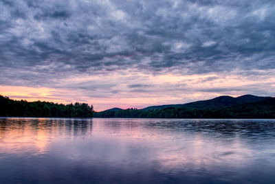 Scenic view of lake against sky during sunset