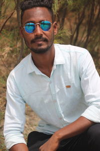 Portrait of young man wearing sunglasses