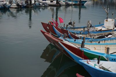 Boats moored in lake