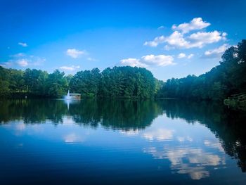 Scenic view of lake against blue sky