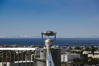 View of cityscape and sea against clear sky