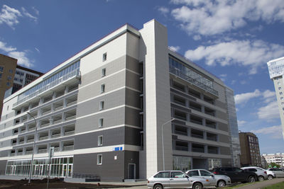 Low angle view of modern buildings against sky in city