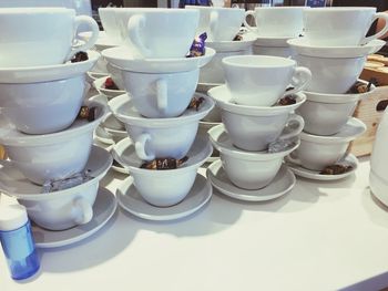 Close-up of coffee cups on table