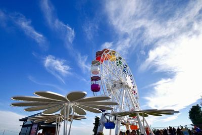 Low angle view of ferris wheel against sky