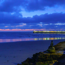 Scenic view of sea against sky at dusk