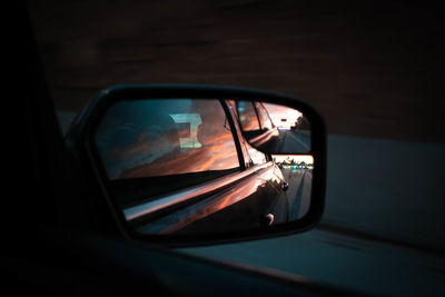 Reflection of car on side-view mirror