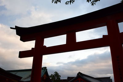 Low angle view of silhouette building against sky during sunset