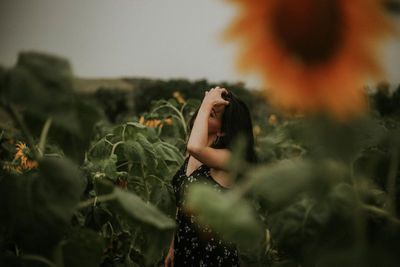 Close-up of woman standing by plants