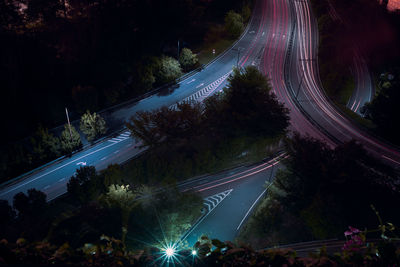 High angle view of light trails on road in city