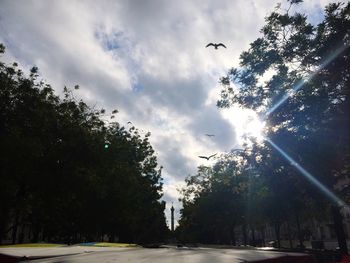 Low angle view of road against cloudy sky