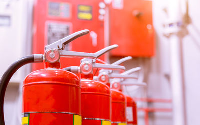 Close-up of fire extinguishers