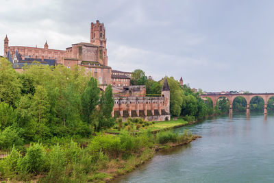 View of tarn river in albi with cathedral and bridge, france