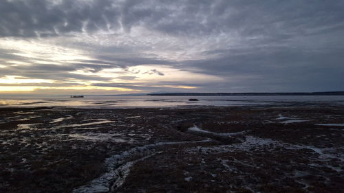 Scenic view of sea against cloudy sky